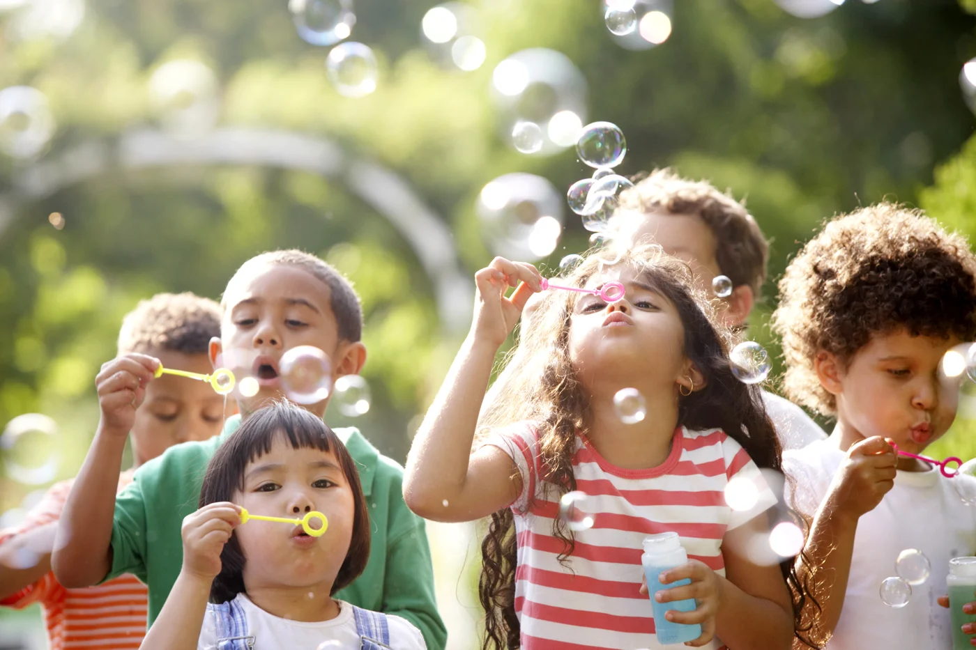 Children enjoying an afternoon blowing bubbles